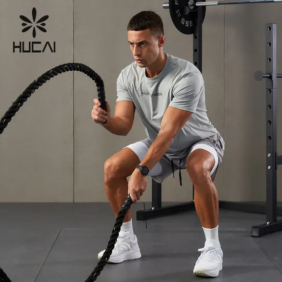 Hucai OEM Custom Polyester Spandex Breathable Drawstring Shorts Active Athletic Clothes Running Workout Sports Gym Men Fitness Clothing 